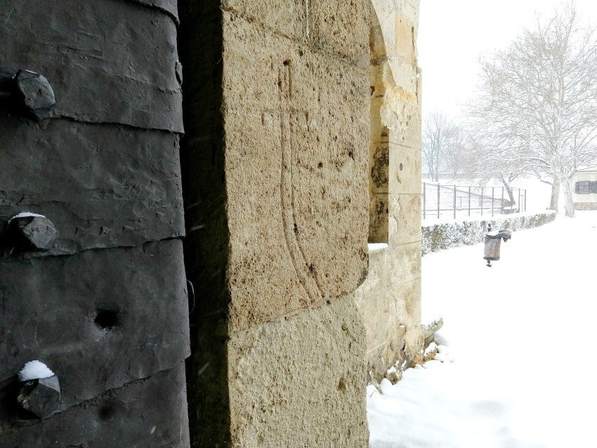 Belgrade Fortress Turkish Sword and Bullet Holes in the gate. Snow in Belgrade