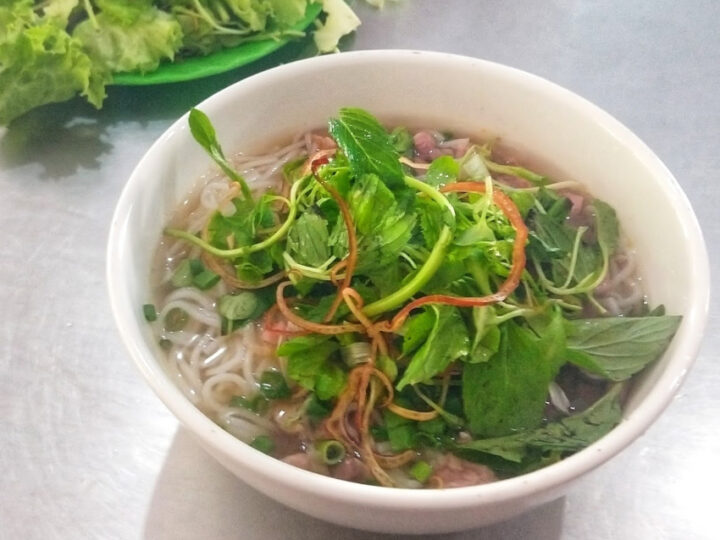 A bowl of Bun Bo Hue Beef Noodle Soup Served in Hue Vietnam