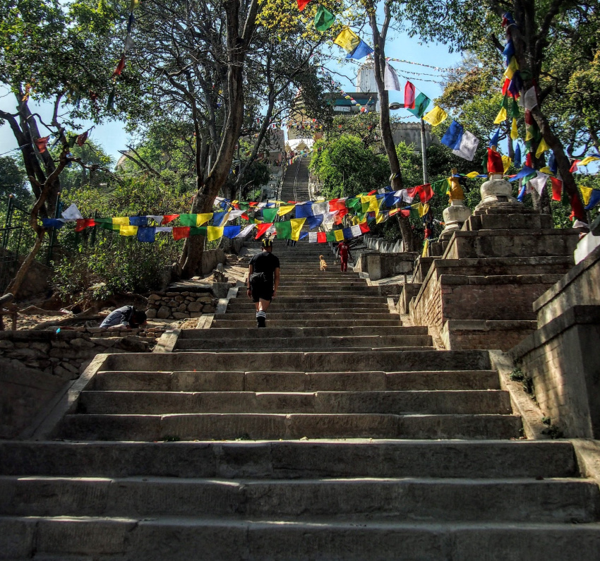 Climbing the Eastern Stairway graves and cemetary at swayambhunath stupa kathmandu